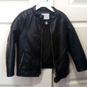 Black non leather jacket with polyester lining.